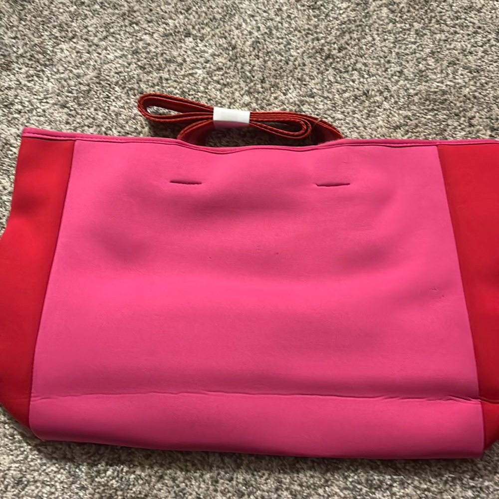 Brand new. Just took out of bag for pics. Tote bag.